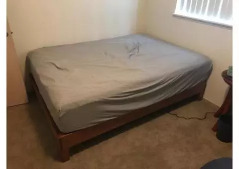 Bed frame with unused mattress( Fred Meyer )  , size full